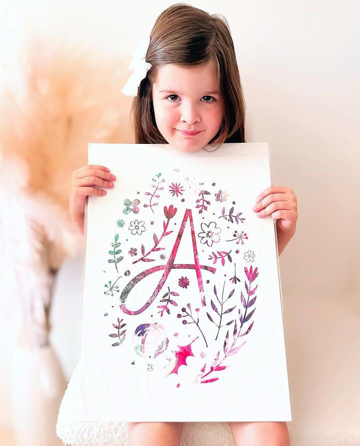 Unique personalised monogram print with floral accents, perfect for a girl's room decor.
